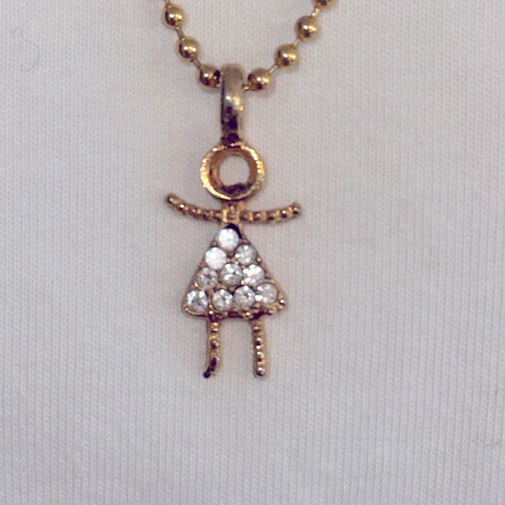 Gold tone girl with rhinestone skirt pendant‎ on gold ball chain